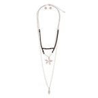 Bella Chic vacation style necklace featuring layered silver chains and a unique floral pendant