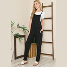 Black women's jumpsuit from Orange Farm Clothing perfect for vacation style overalls with pockets