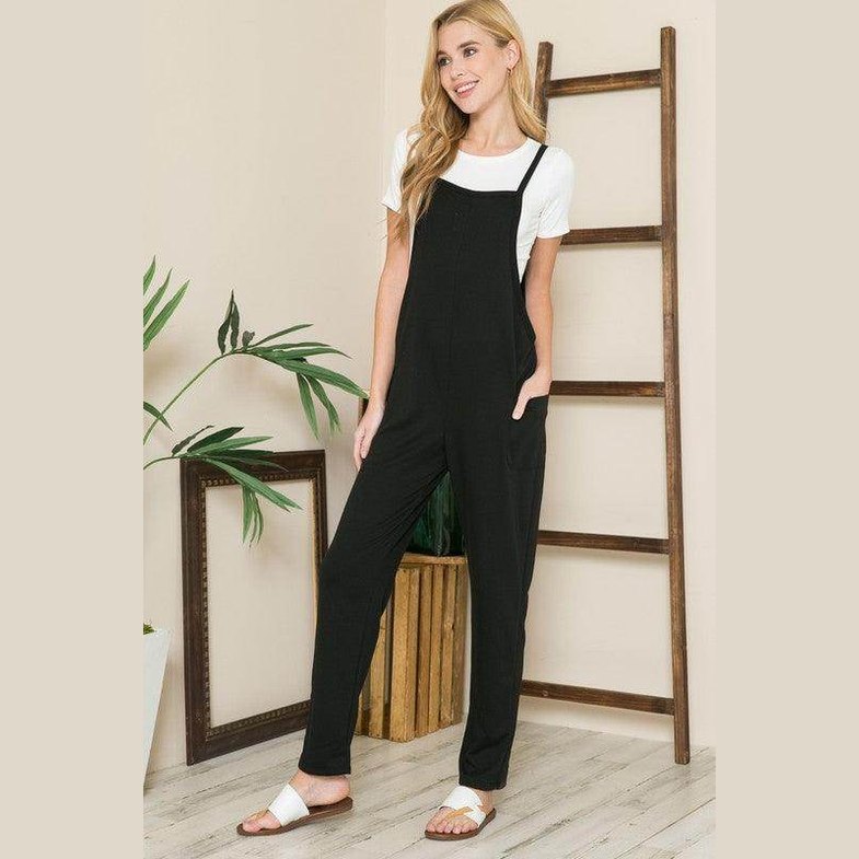 Black women's jumpsuit from Orange Farm Clothing perfect for vacation style overalls with pockets