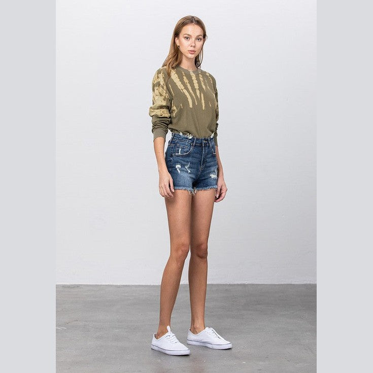 Denim Lab USA vacation style women's shorts in distressed blue denim, paired with a casual top