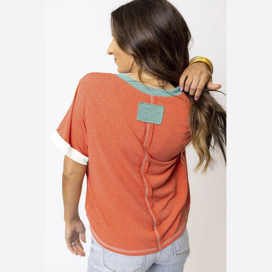 YNIQUE casual vacation style womens t-shirt in orange with teal accents and rolled sleeves