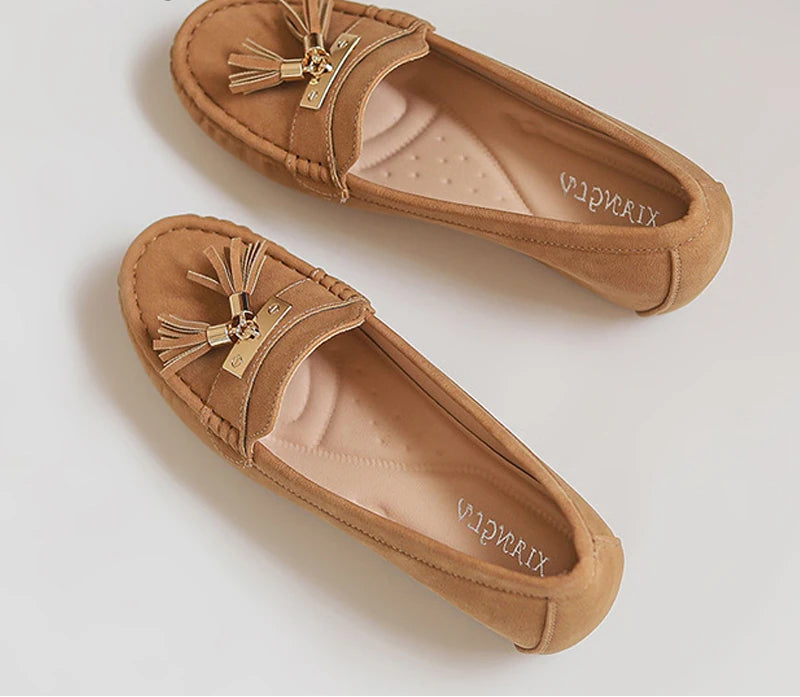 Women's tan loafers with tassels, vacation worthy footwear
