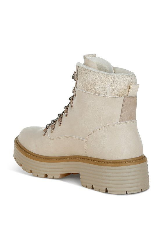 VacationGrabs beige lace-up chunky ankle boots with cozy faux-fur lining and a slip-resistant lug sole for travel.