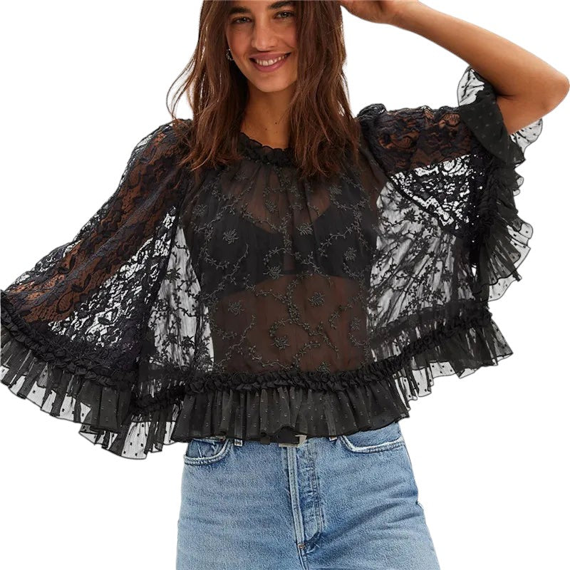 VacationGrabs black sheer lace boho blouse with flared long sleeves and ruffle trim worn by a smiling woman