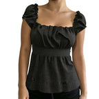 VacationGrabs black polka dot peplum top with square neckline and puff sleeves in a Y2K-inspired slim fit style