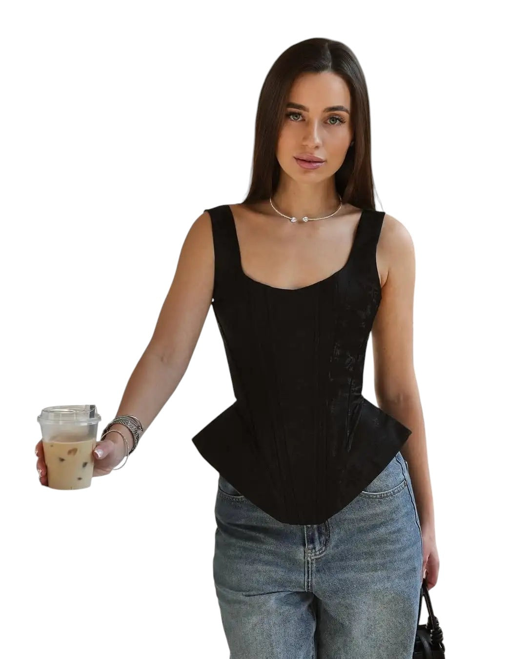 VacationGrabs black satin corset top with wide straps worn by a woman in a cafe setting with blue jeans.