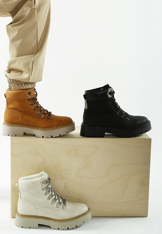 VacationGrabs lace-up chunky ankle boots in tan, black, and white with cushioned soles for comfortable winter travel.
