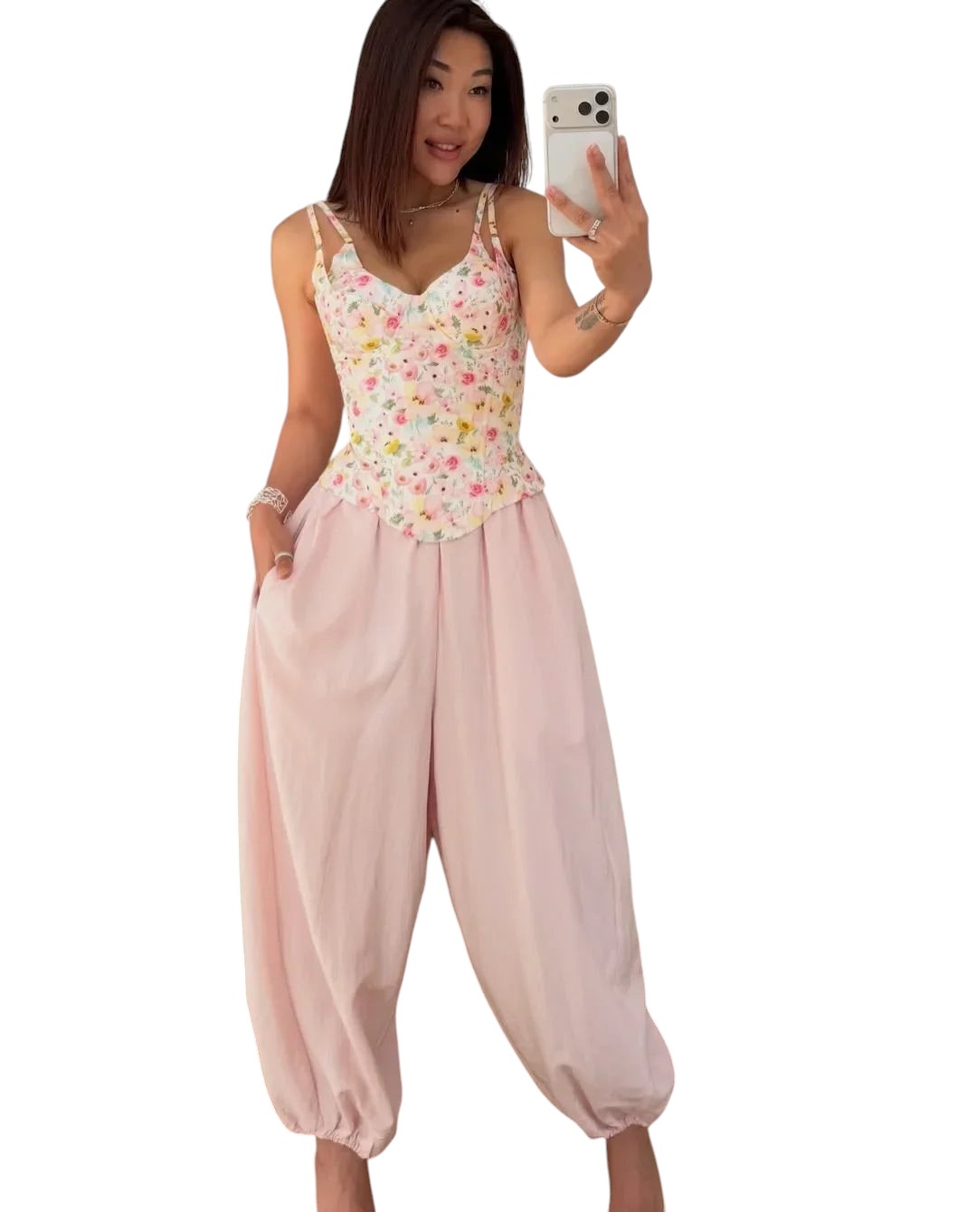 VacationGrabs floral print corset cami top with fishbone detailing paired with loose light pink trousers