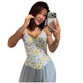 VacationGrabs floral print corset cami with fishbone detailing worn by a woman taking a mirror selfie