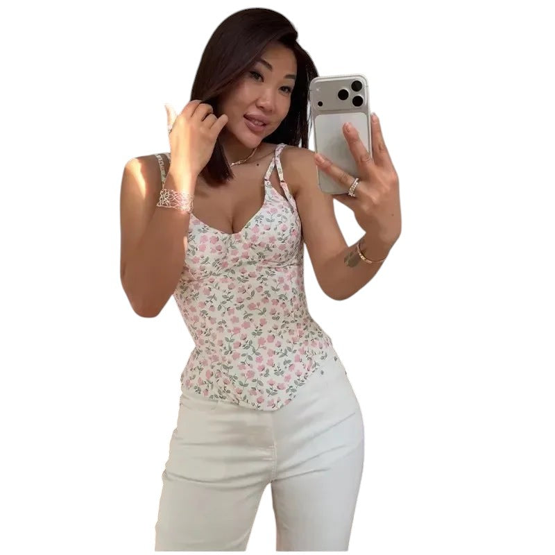 VacationGrabs floral print corset cami with fishbone detailing worn by a woman taking a mirror selfie