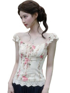 VacationGrabs floral corset top with puff sleeves and lace hem worn by a woman with an elegant updo hairstyle