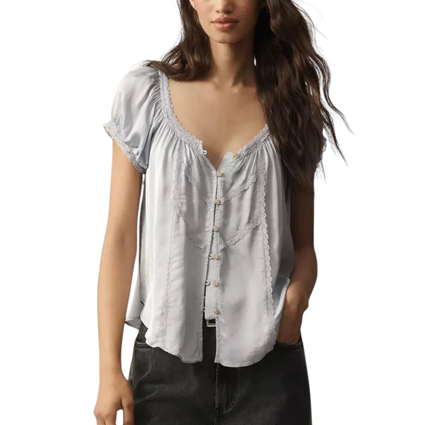VacationGrabs light blue cropped blouse with button-up front, lace trim, and short sleeves on a model