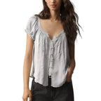 VacationGrabs light blue cropped blouse with button-up front, lace trim, and short sleeves on a model