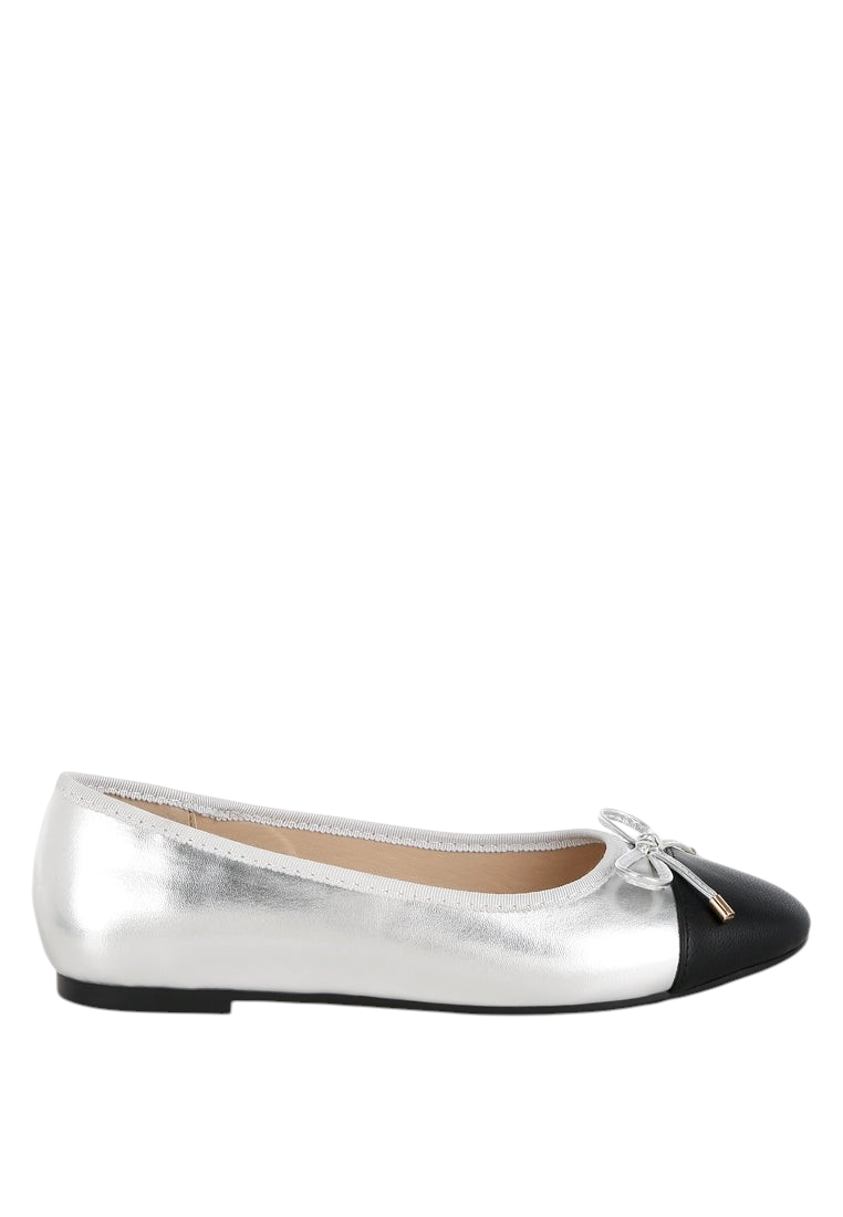 VacationGrabs Minato two-tone silver and black faux leather ballet flats with a bow and almond toe.
