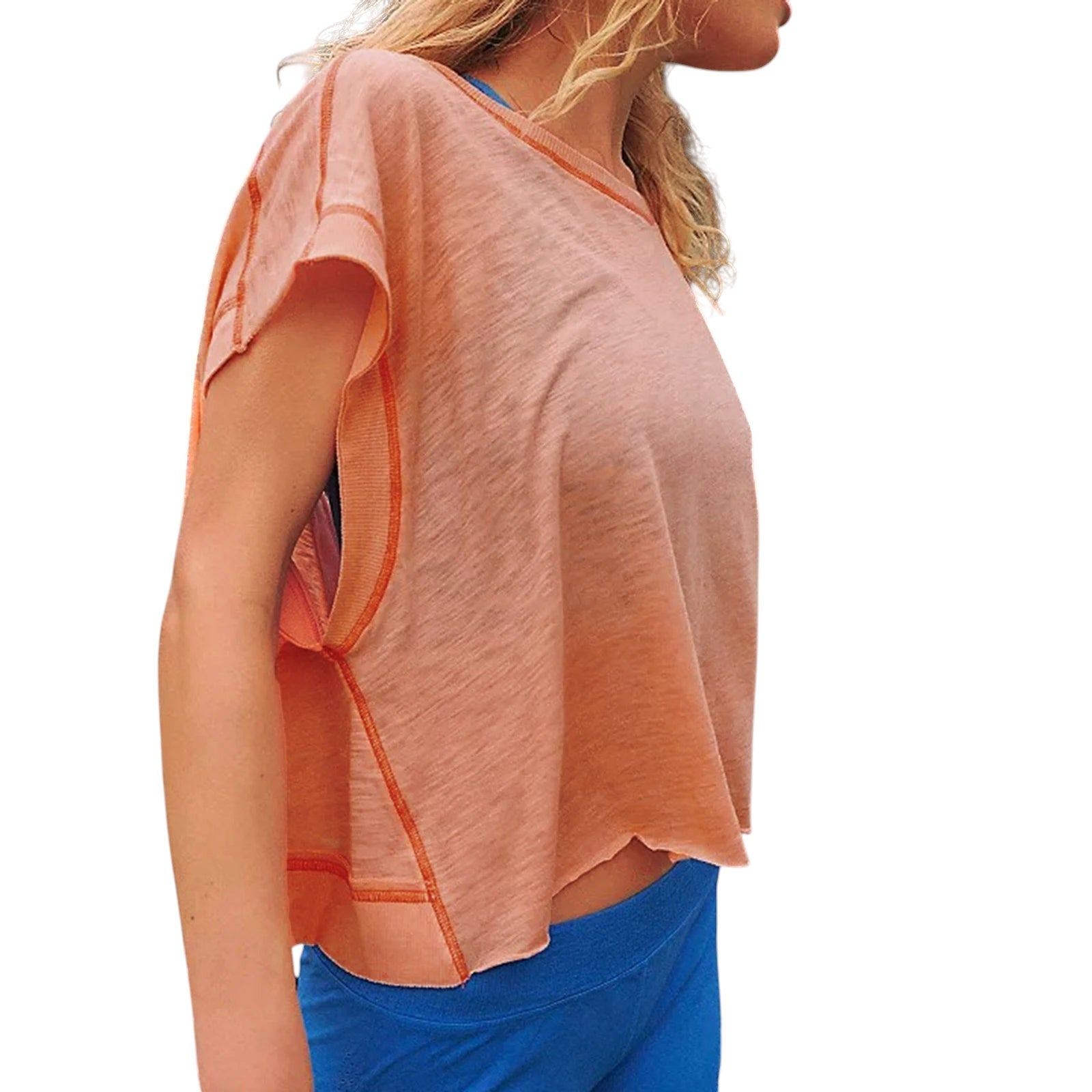 VacationGrabs peach short-sleeve crop top with a relaxed fit and raw hem detail, perfect for summer beach vacations.