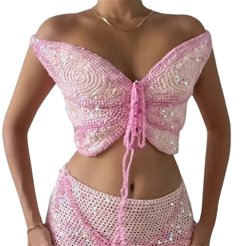 VacationGrabs pink crochet butterfly crop top with sequin embellishments, halter neck, and lace-up front detail.