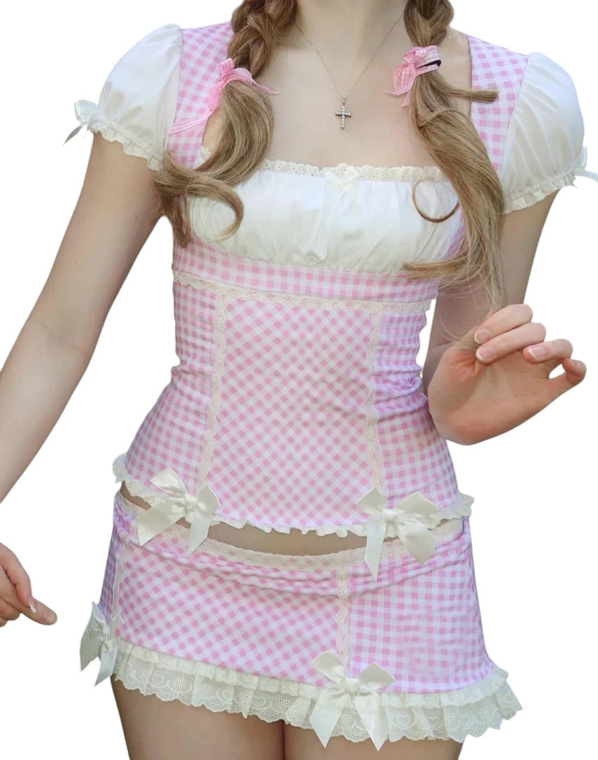 VacationGrabs Y2K pink gingham two-piece set with lace trim, sweetheart crop top, and mini skirt on a model.