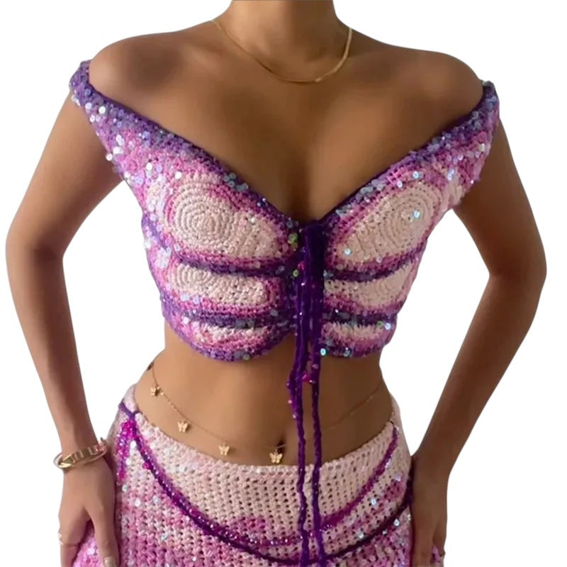VacationGrabs purple and pink crochet butterfly crop top with sequin embellishments and off-shoulder halter neckline.