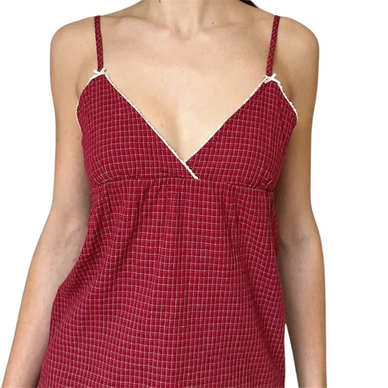 VacationGrabs red plaid peplum camisole with white lace trim, spaghetti straps, and a V-neckline in a Y2K style.