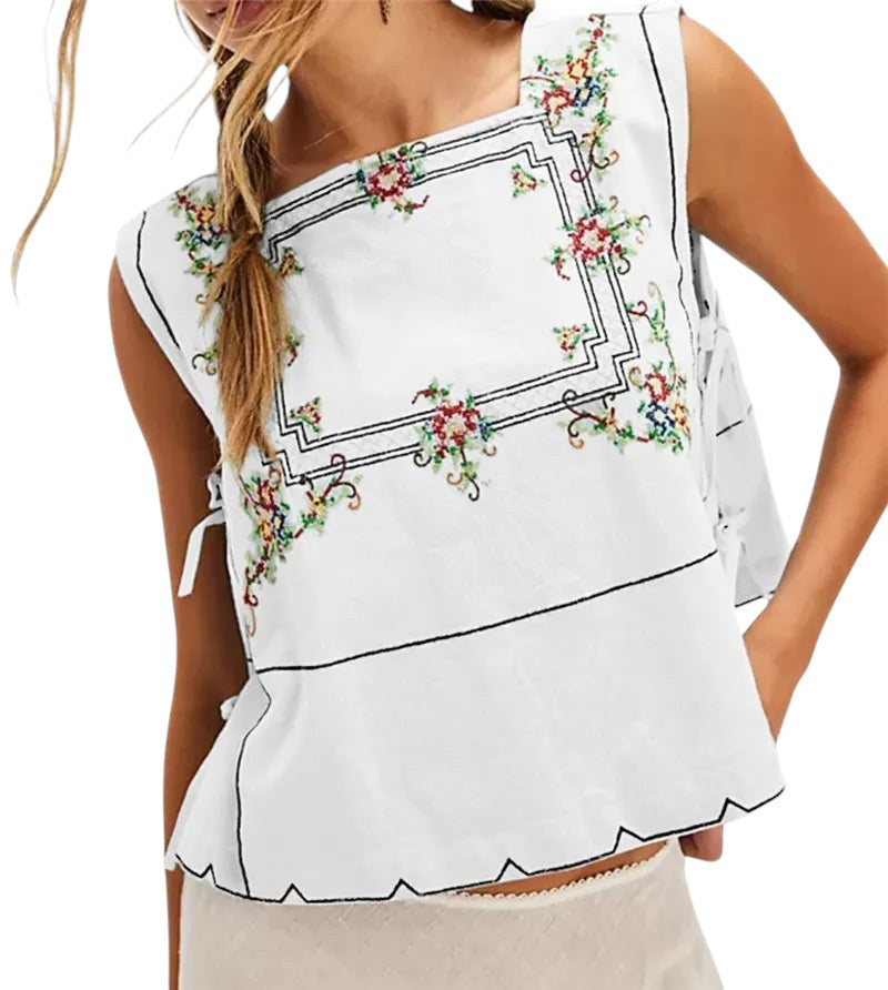 VacationGrabs white sleeveless crop top with square neckline, floral embroidery, and side tie-up details.