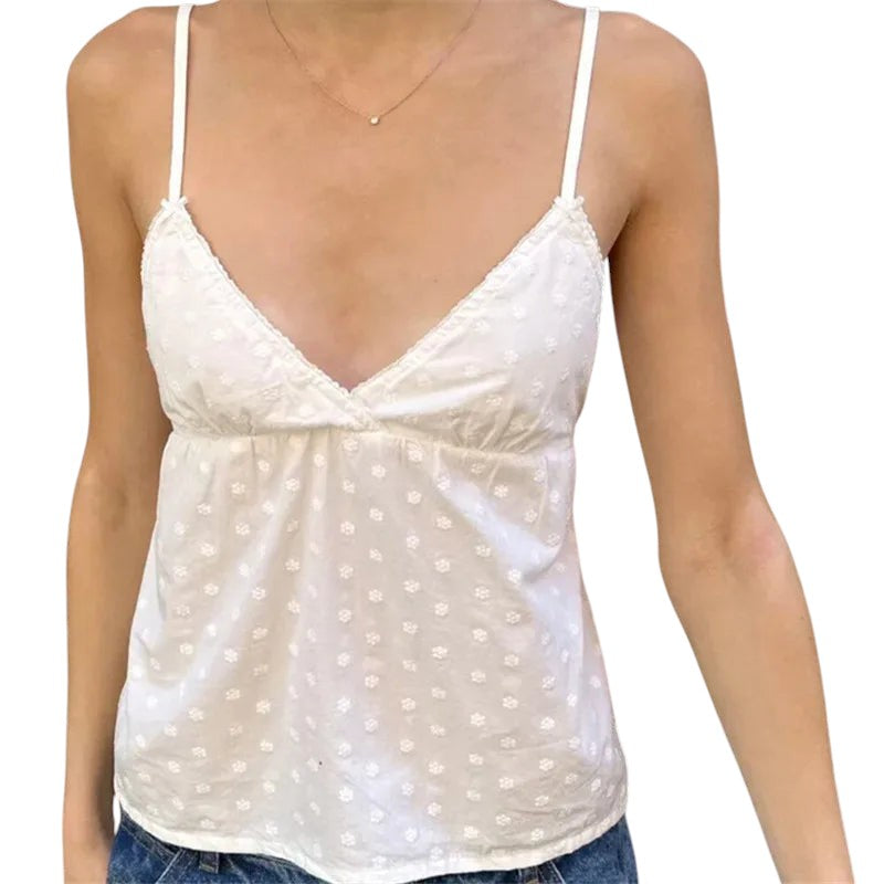VacationGrabs white lace trim peplum camisole with spaghetti straps and a V-neck in a cropped babydoll silhouette.