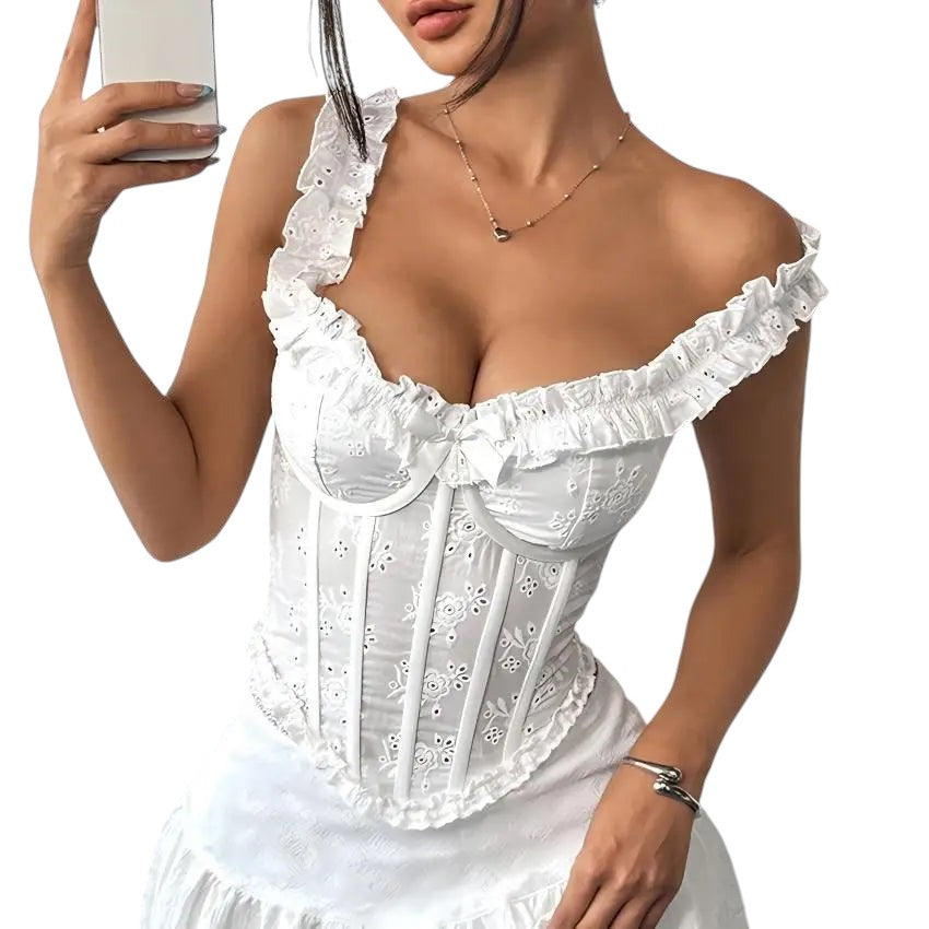 VacationGrabs white satin corset top with delicate floral embroidery, ruffled neckline, and wide straps.