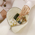 Travel cosmetic pouch, cream color, for organizing makeup and toiletries