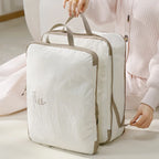 Travel vacuum storage bags with handles for efficient packing