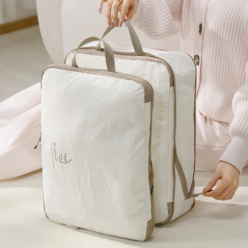 Travel vacuum storage bags with handles for efficient packing
