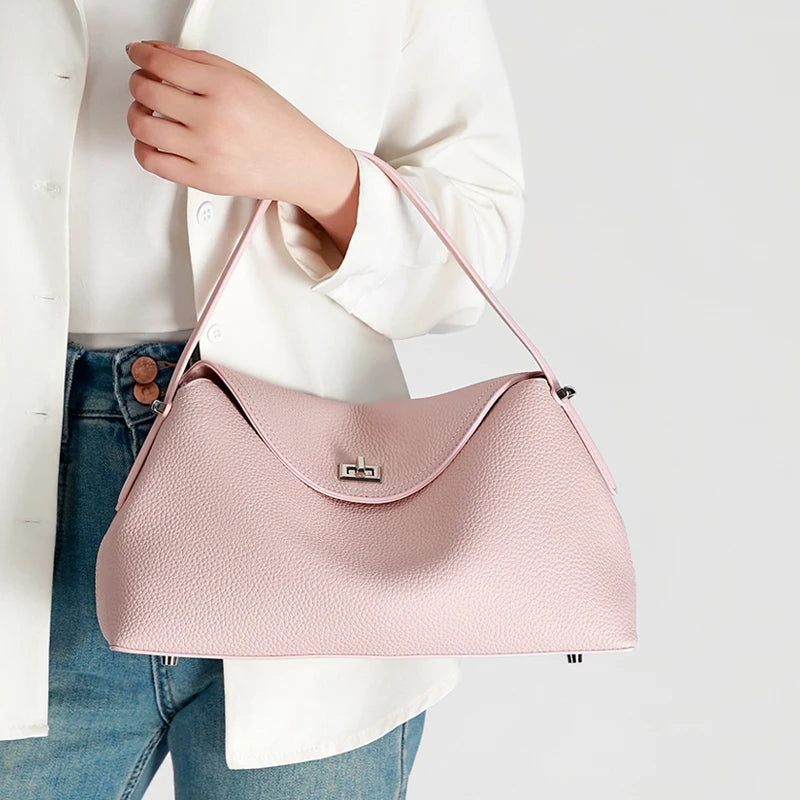 Pink vegan leather handbag, stylish accessory for casual outings