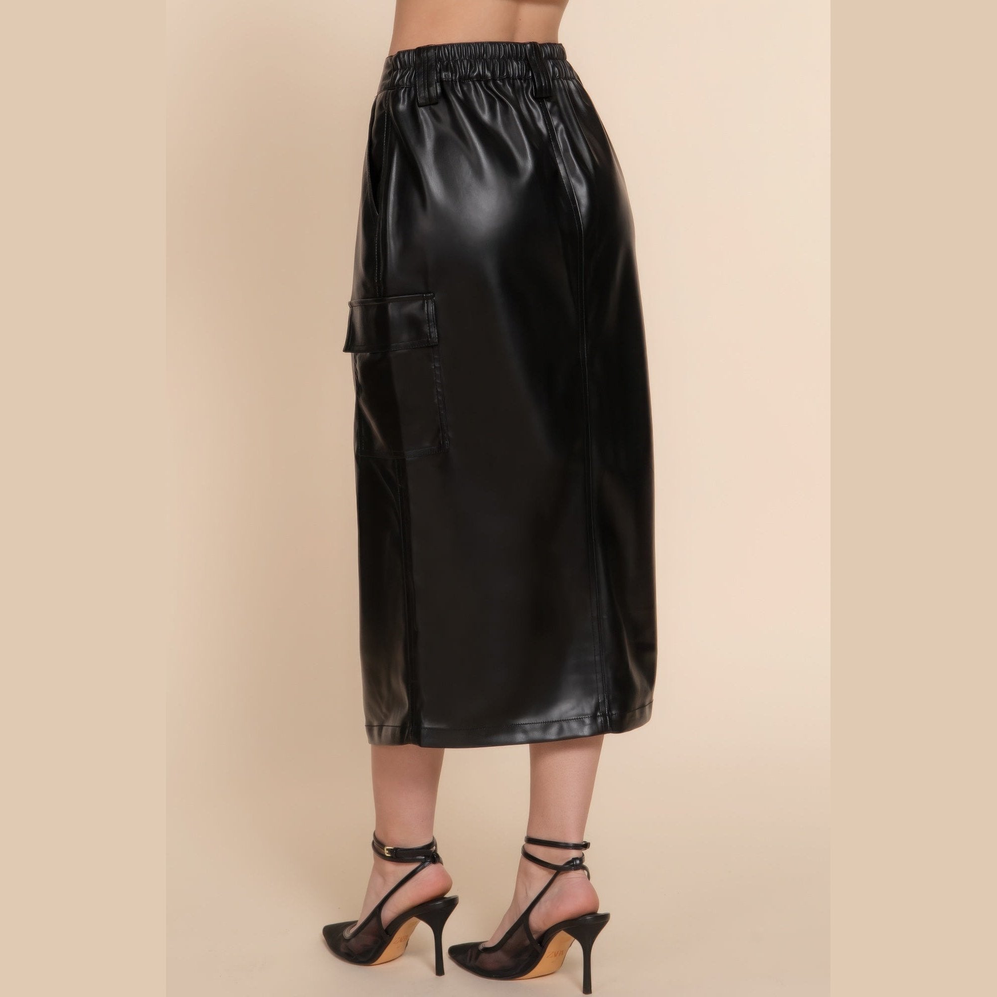 VacationGrabs black vegan leather midi skirt with pockets featuring elastic waistband and sleek design