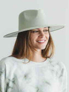 Stylish woman wearing a vegan panama hat with a wide brim for sun protection and fashion
