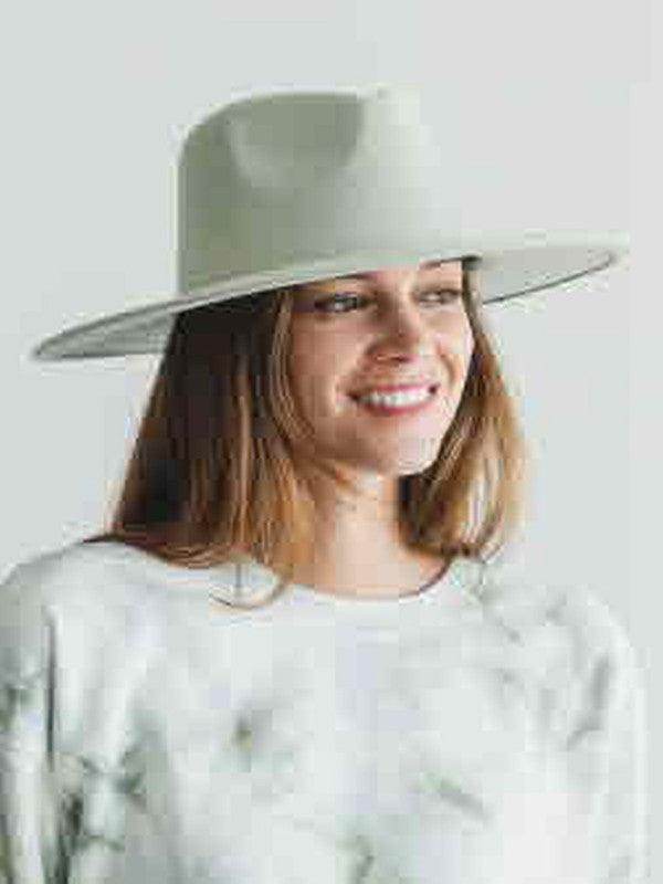 Stylish woman wearing a vegan panama hat with a wide brim for sun protection and fashion