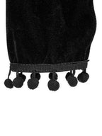 Black cropped top with pom pom detail in velvet steampunk fashion for a stylish look