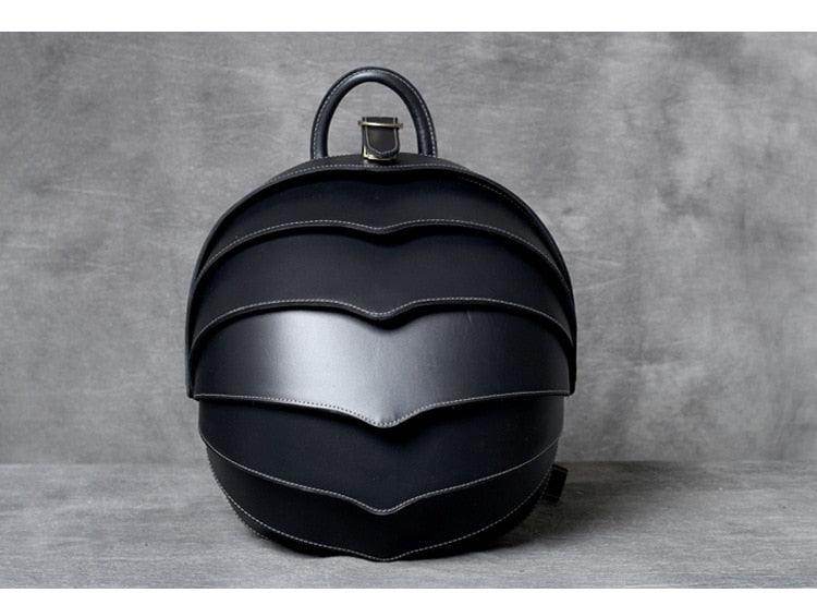 Accordion beetle daypack by VacationGrabs with a unique layered design in black leather