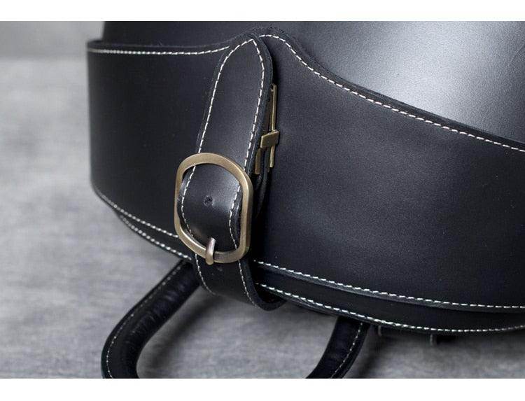 Close-up of the buckle on the VacationGrabs accordion beetle daypack showcasing its durable leather design