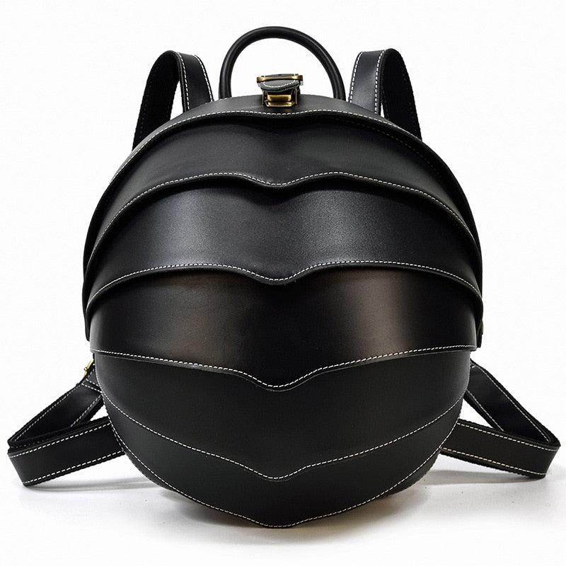 Stylish black accordion beetle daypack with unique curved design and adjustable straps for everyday use
