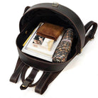 Accordion beetle daypack in brown leather with spacious interior for books and personal items