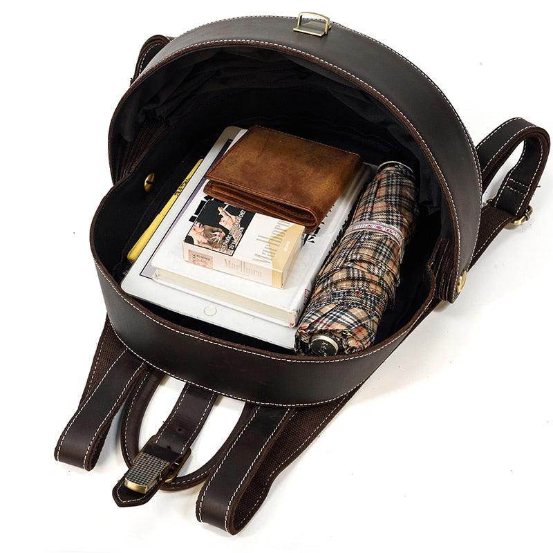 Accordion beetle daypack in brown leather with spacious interior for books and personal items