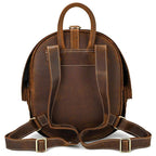 Accordion beetle daypack in brown leather with dual straps and top handle for easy carrying