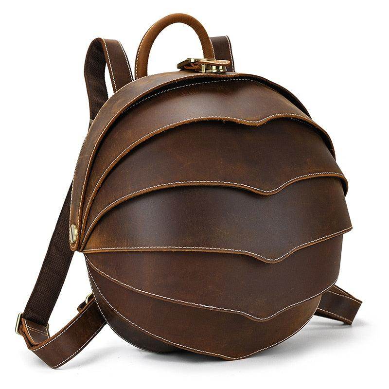 Accordion beetle daypack in brown leather with unique layered design and adjustable straps