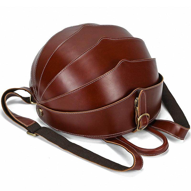 Accordion beetle daypack in rich brown leather with adjustable straps for stylish travel