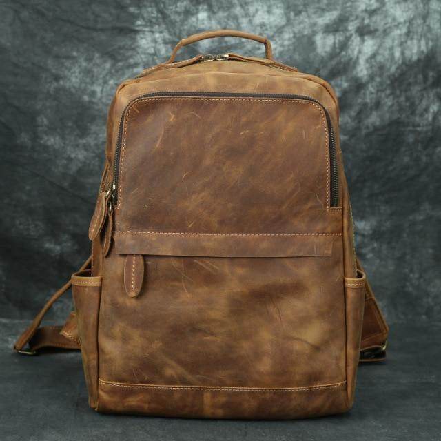 Brown leather overnight bag featuring a spacious main compartment and sturdy straps for travel convenience
