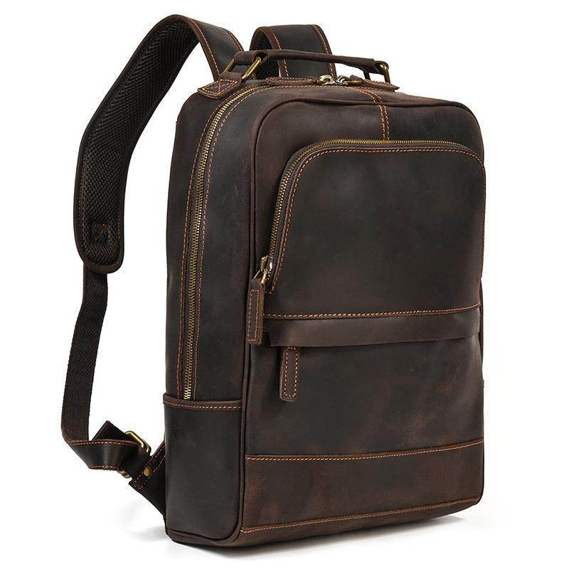 Brown leather overnight bag with adjustable straps and multiple pockets for travel convenience