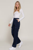 VacationGrabs women's navy casual straight leg trousers with cargo pockets paired with white long sleeve top