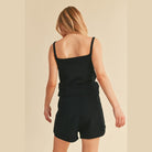 Aemi Co black casual tank and shorts set worn by woman showing back view