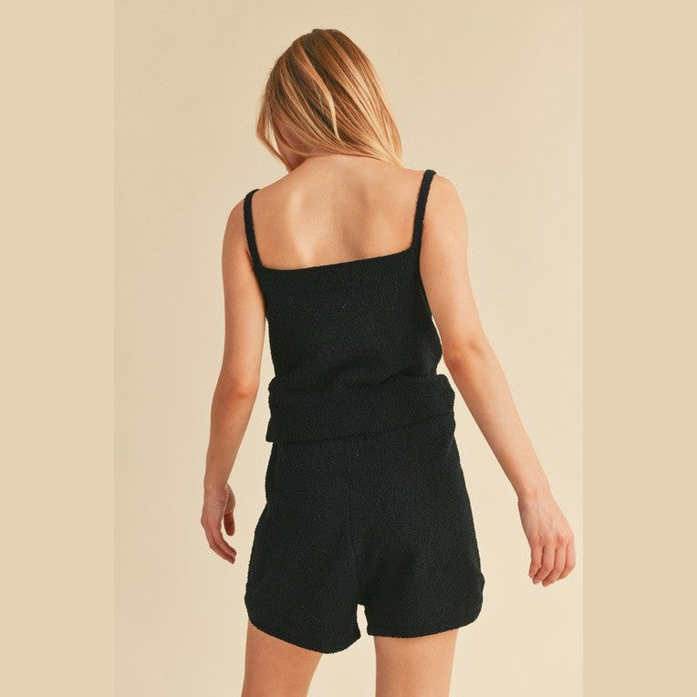Aemi Co black casual tank and shorts set worn by woman showing back view