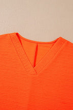 YNIQUE bright orange textured v-neck top perfect casual vacation outfit for women