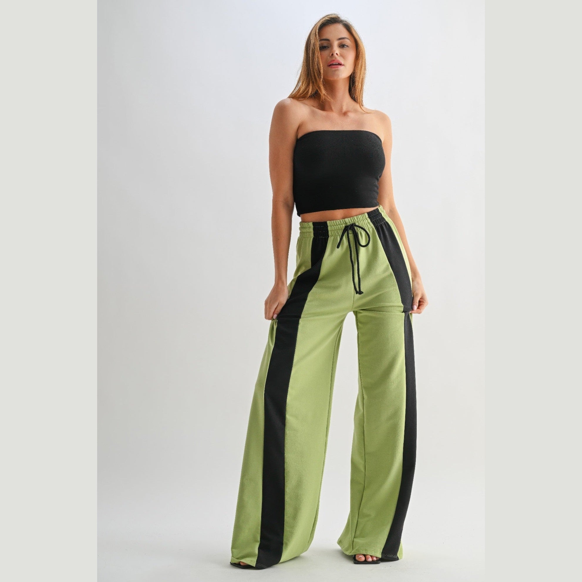 VacationGrabs comfortable wide leg lounge trousers in green with black stripes worn by woman
