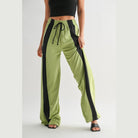 VacationGrabs women's comfortable wide leg lounge trousers in green with black side stripes and drawstring waist